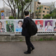A man in Seoul, South Korea looks at posters showing candidates for presidential election on April 20, 2017 (AP Photo/Ahn Young-joon)